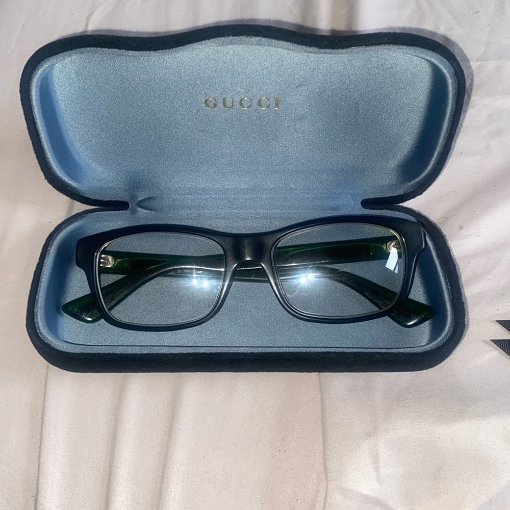 Gucci glasses. Reading glasses with the iconic red an green colors on the stems.